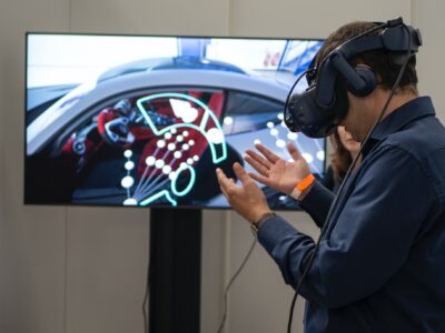 A male using VR headset to enter to a vr car