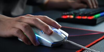 best gaming mouse white in color with a black keyboard along side
