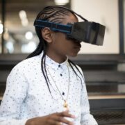 A Black Kid wearing the black VR Headset.